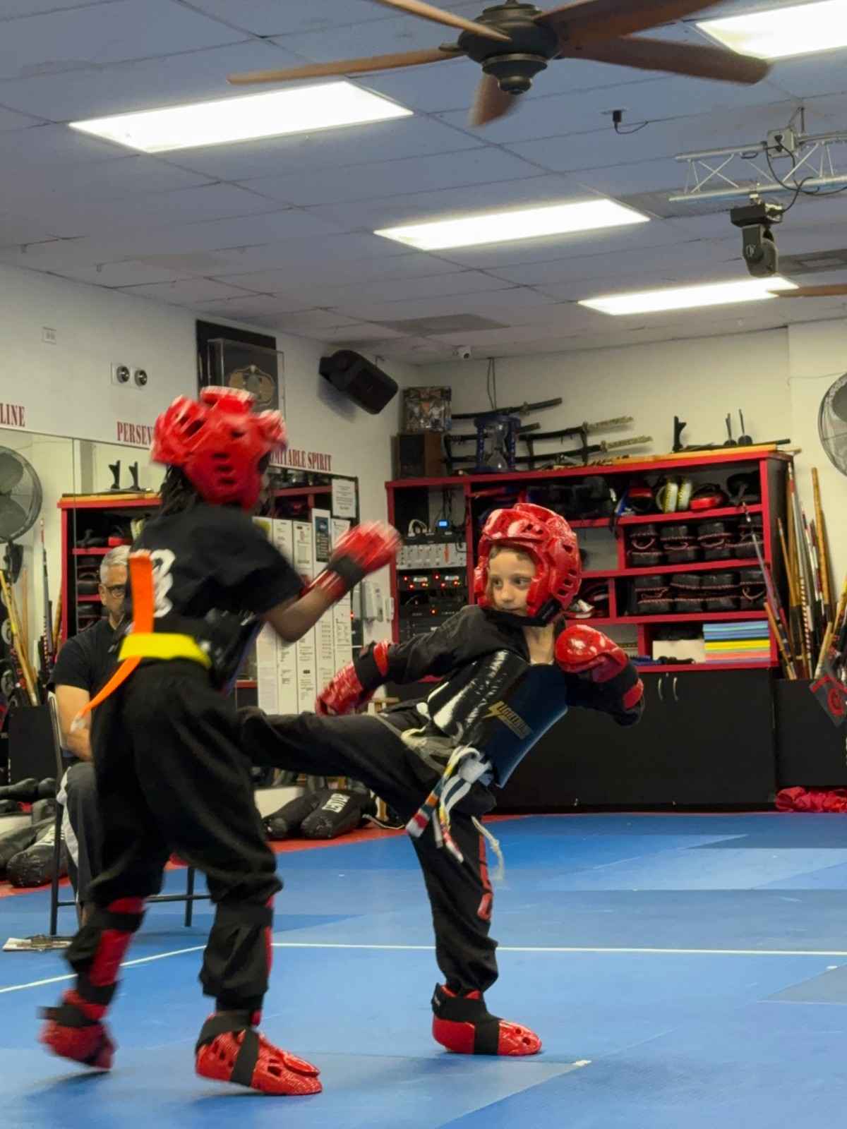 young students practicing kids martial arts techniques