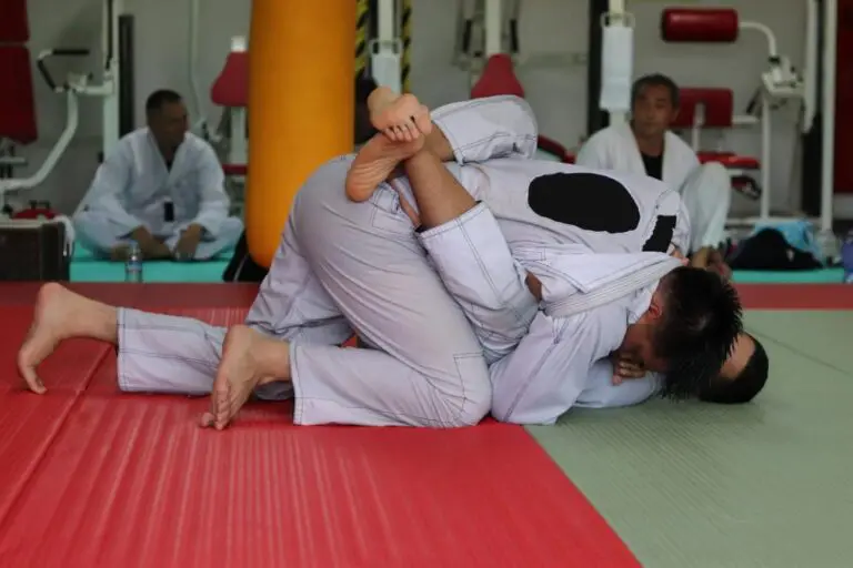 No-gi jiu jitsu training session with two athletes working on guard and balance control