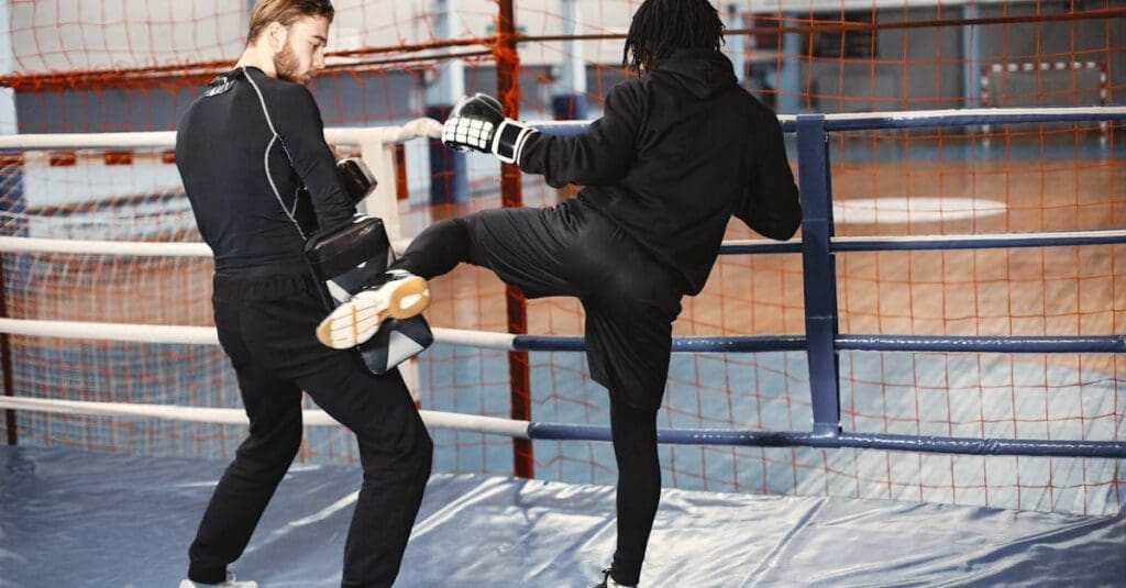 A focused female athlete throws a precise side kick at a heavy bag, illustrating proper form for a beginner kick boxing guide.